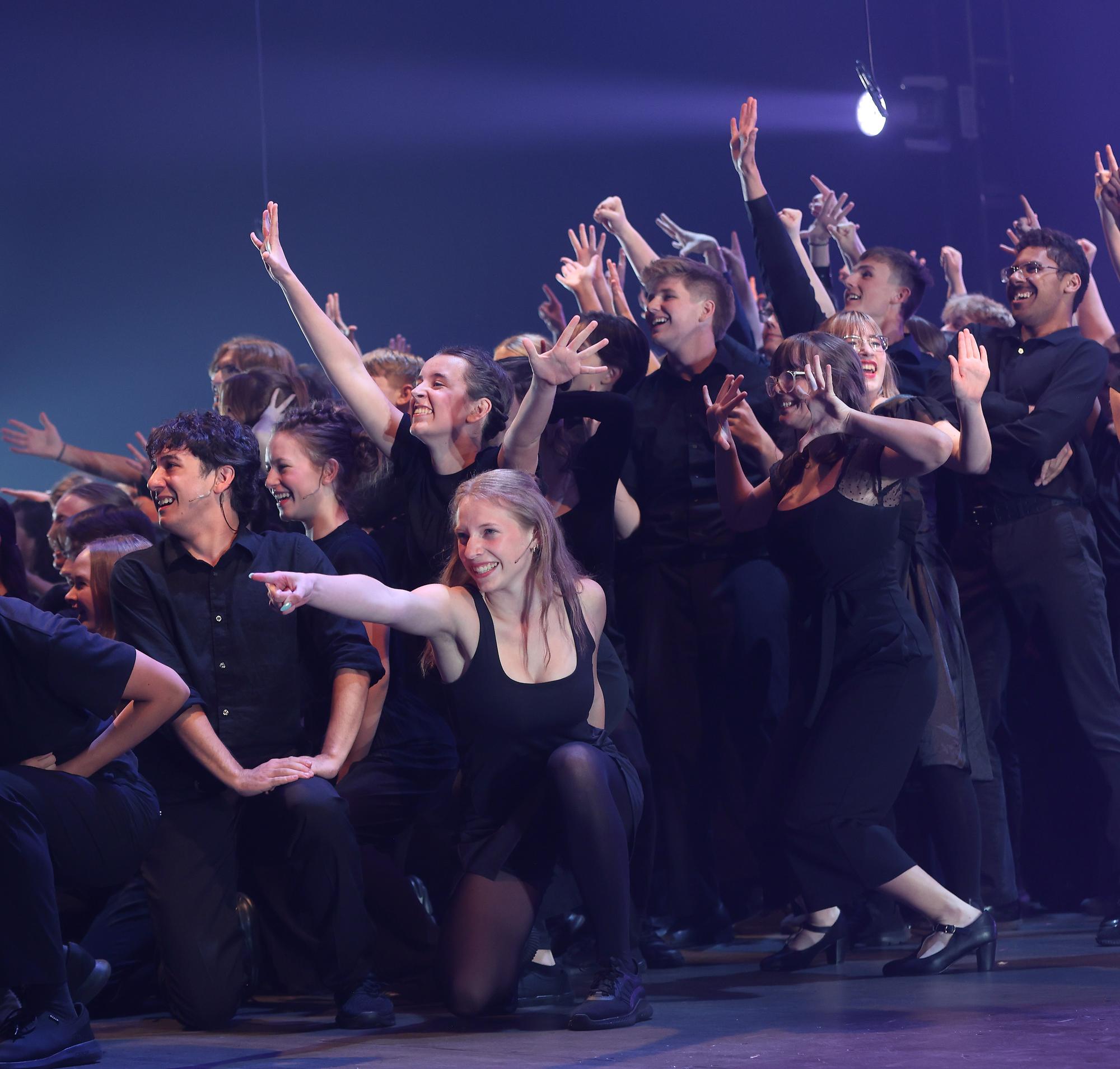 High school performers celebrate on stage at the Iowa High School Musical Theater Awards